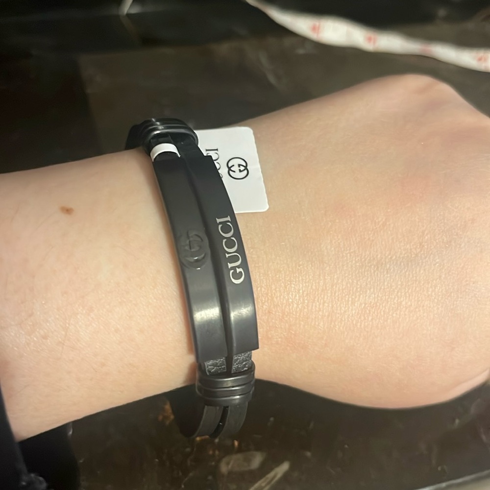 Black leather like bracelet. Size 8 inches. For men or women. Never worn.